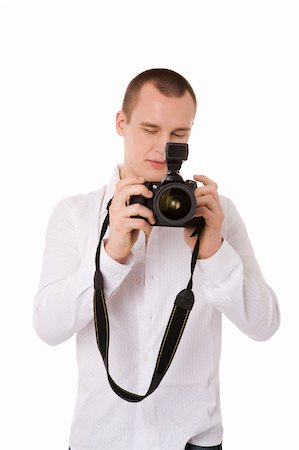 simsearch:400-04270950,k - young confident Photographer choosing right shot isolated Stockbilder - Microstock & Abonnement, Bildnummer: 400-05313103