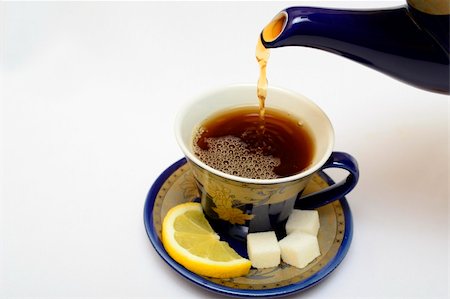 Photo of a mug of tea with a lemon and sugar. Stock Photo - Budget Royalty-Free & Subscription, Code: 400-05313582