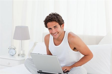 Man working on his laptop at home Stock Photo - Budget Royalty-Free & Subscription, Code: 400-05313734