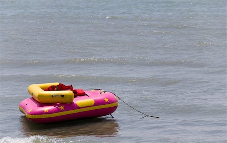 rubber life jacket - Inflatable raft floating on the sea. Stock Photo - Budget Royalty-Free & Subscription, Code: 400-05324368