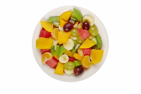 salad greens on white background - Tropical fruit salad on white plate on white background photographed from above (Isolated) Stock Photo - Budget Royalty-Free & Subscription, Code: 400-05324759