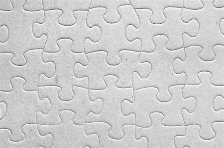 Unity:blank grey jigsaw puzzle pieces all connected, great details of textured cardboard material Fotografie stock - Microstock e Abbonamento, Codice: 400-05325397