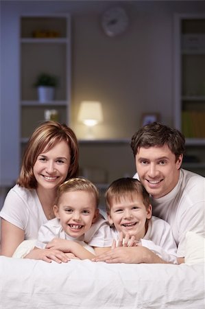 family lamp home - Families with children in bed at night Stock Photo - Budget Royalty-Free & Subscription, Code: 400-05325823