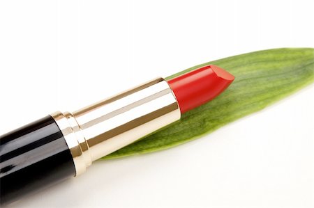 simsearch:400-04575822,k - glamor red shiny lipstick and green leaf isolated on white background Photographie de stock - Aubaine LD & Abonnement, Code: 400-05325875