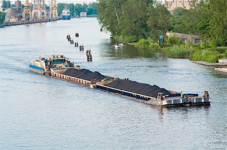 coal barge sailing on the river with cargo Stock Photo - Budget Royalty-Free & Subscription, Code: 400-05326301