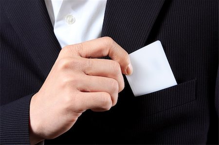 revers - Businessman Holding a Card out of his suit pocket Stockbilder - Microstock & Abonnement, Bildnummer: 400-05326472