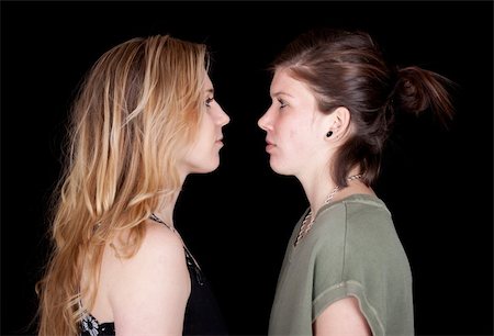 strotter13 (artist) - Two woman stare at each other.  They are complete opposites, but both are beautiful. Photographie de stock - Aubaine LD & Abonnement, Code: 400-05326677