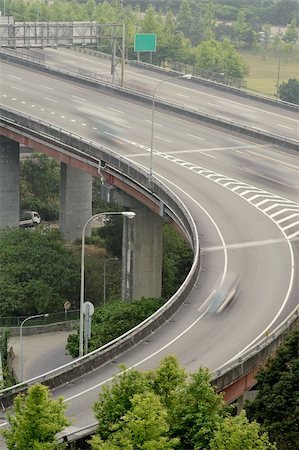 schienenkreuzung - Interchange in highway with cars motion blurred in daytime in Taipei, Taiwan, Asia. Stockbilder - Microstock & Abonnement, Bildnummer: 400-05326786