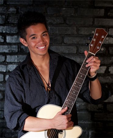 strotter13 (artist) - A photograph of a handsome young man with his Guitar Photographie de stock - Aubaine LD & Abonnement, Code: 400-05327197