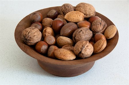 franky242 (artist) - assortment of several kind of nuts in a wooden bowl Fotografie stock - Microstock e Abbonamento, Codice: 400-05327555