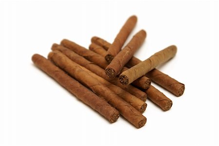 simsearch:400-05292494,k - An isolated group of ten cigars rolled with a tobacco leaf. Stock Photo - Budget Royalty-Free & Subscription, Code: 400-05327925