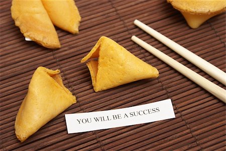 financial advising chinese - A low contrast still life image of a fortune cookie with a message stating that you will be a success. Stock Photo - Budget Royalty-Free & Subscription, Code: 400-05327930