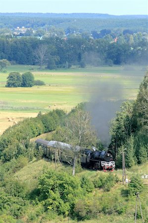 simsearch:400-04609507,k - Beautiful hilly landscape with an old retro steam train Fotografie stock - Microstock e Abbonamento, Codice: 400-05328086
