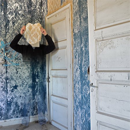 Ghostly figure fading into the peeling wallpaper wall of an abandoned house. Stock Photo - Budget Royalty-Free & Subscription, Code: 400-05328451