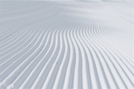 ski trail - tracks on ski slopes in snow at beautiful sunny  winter day with blue sky Stock Photo - Budget Royalty-Free & Subscription, Code: 400-05328804