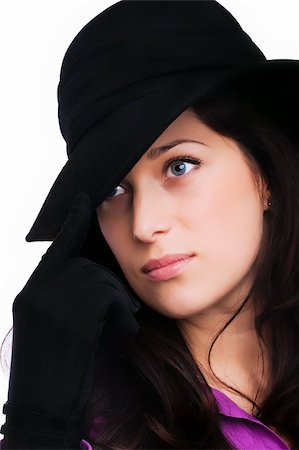 Portrait of a beautiful brunette young woman with black hat and gloves Stock Photo - Budget Royalty-Free & Subscription, Code: 400-05328842