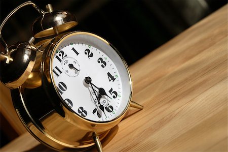 simsearch:700-05974049,k - Nice alarm clock closeup standing on wooden surface Stock Photo - Budget Royalty-Free & Subscription, Code: 400-05328850