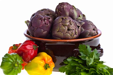 small exotic peppers and artichokes on a white background Photographie de stock - Aubaine LD & Abonnement, Code: 400-05328940