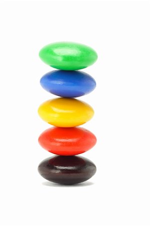 simsearch:400-04855702,k - Stack of colorful button candies on white background Photographie de stock - Aubaine LD & Abonnement, Code: 400-05328980