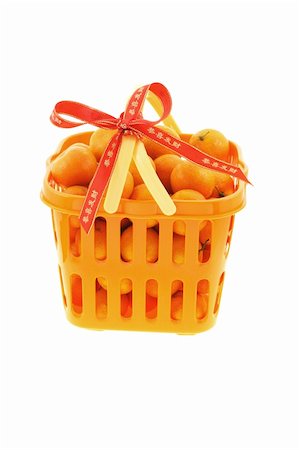 Basket full of mandarin oranges decorated with prosperous Chinese New Year ribbon Stock Photo - Budget Royalty-Free & Subscription, Code: 400-05329031