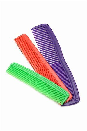 Three colorful plastic combs on white background Stock Photo - Budget Royalty-Free & Subscription, Code: 400-05329071