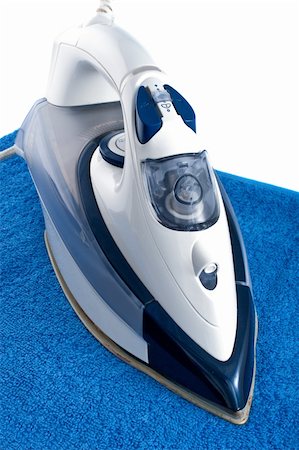 simsearch:400-04019890,k - Electric iron on blue towel Stock Photo - Budget Royalty-Free & Subscription, Code: 400-05329090