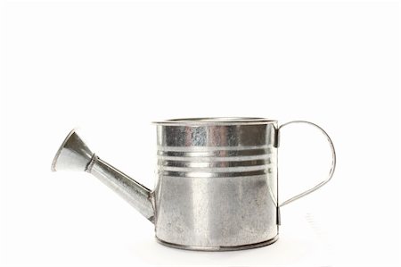 Watering Can- Tilted isolated on a white background Stock Photo - Budget Royalty-Free & Subscription, Code: 400-05329255