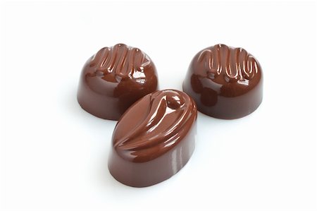 simsearch:400-06142439,k - Chocolate candies. Closeup,isolated on the white Stock Photo - Budget Royalty-Free & Subscription, Code: 400-05329603