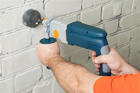drilling wall - Builder hold perforator and drilling brick wall Stock Photo - Budget Royalty-Free & Subscription, Code: 400-05329656