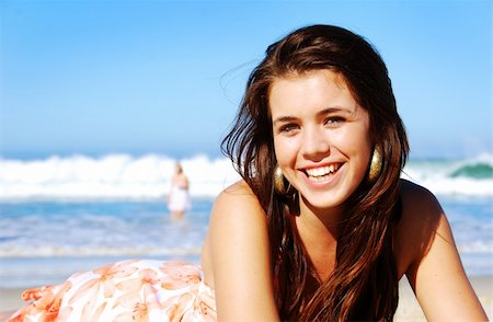 Young woman enjoying summer on the beach Stock Photo - Budget Royalty-Free & Subscription, Code: 400-05329926