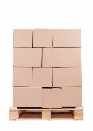 simsearch:700-05389538,k - cardboard boxes on wooden palette, photo on white Photographie de stock - Aubaine LD & Abonnement, Code: 400-05329992