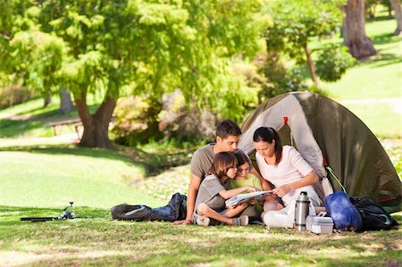 father son camping woods - Family camping in the park Stock Photo - Budget Royalty-Free & Subscription, Code: 400-05320581