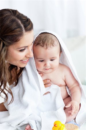 plastic toy family - Delighted mother drying her baby after his bath at home Stock Photo - Budget Royalty-Free & Subscription, Code: 400-05320835