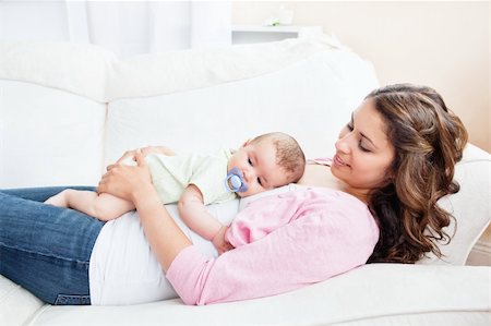 simsearch:400-05320841,k - Young mother taking care of her adorable baby at home Stock Photo - Budget Royalty-Free & Subscription, Code: 400-05320837