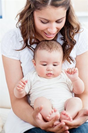 simsearch:400-05320841,k - Pretty young mother taking care of her adorable baby at home Stock Photo - Budget Royalty-Free & Subscription, Code: 400-05320831