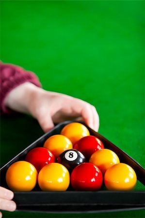 play a triangle - Close-up of a snooker player placing balls with triangle in a pool club Stock Photo - Budget Royalty-Free & Subscription, Code: 400-05320869