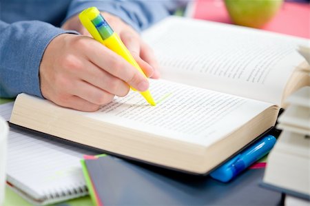 simsearch:400-04841324,k - Close-up of a serious male teenager studying in the cafeteria of his university Photographie de stock - Aubaine LD & Abonnement, Code: 400-05320875