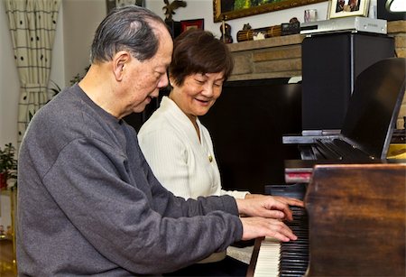 senior woman piano - Senior couple having fun playing the piano Stock Photo - Budget Royalty-Free & Subscription, Code: 400-05320934