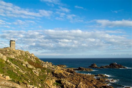 Watchtower from the German occupation of Jersey overlooks the rocks coastline at Corbiere, With terrific 360 degree views from the panaramic windows, it can now be rented out as apartments. Stock Photo - Budget Royalty-Free & Subscription, Code: 400-05321009