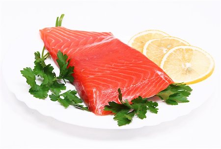 simsearch:400-08070549,k - Salmon steak with lemon slices and parsley on white plate isolated on white background Stockbilder - Microstock & Abonnement, Bildnummer: 400-05321160