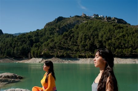 MOther and daughter, yoga at beautiful lakeside setting Stock Photo - Budget Royalty-Free & Subscription, Code: 400-05321304