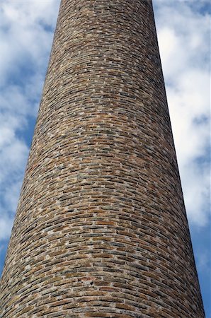 perspective macro - Weathered brick chimney of an old factory. Industrial architecture. Stock Photo - Budget Royalty-Free & Subscription, Code: 400-05321401