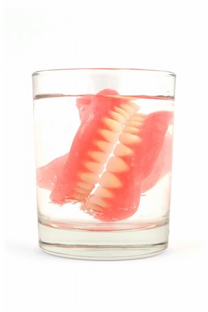 dentures in a glass of water Fotografie stock - Microstock e Abbonamento, Codice: 400-05321802