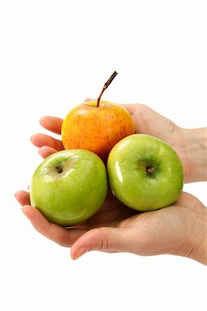 Beautiful woman's hands holding apple isolated on a white background. Foto de stock - Super Valor sin royalties y Suscripción, Código: 400-05322130