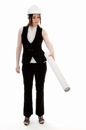 Young business woman wearing a business suit and construction had holding a white tube and pointing down against a white background Stock Photo - Budget Royalty-Free & Subscription, Code: 400-05322335