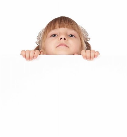 simsearch:400-04340435,k - Smiling little girl holding empty white board Stock Photo - Budget Royalty-Free & Subscription, Code: 400-05322540