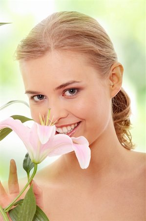 simsearch:400-04845088,k - Portrait of the attractive girl without a make-up, with lily flower in hand Stock Photo - Budget Royalty-Free & Subscription, Code: 400-05322968