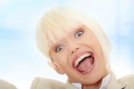 portrait screaming girl - Young business woman shouting,Over abstract blue background Stock Photo - Budget Royalty-Free & Subscription, Code: 400-05323277