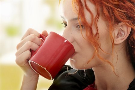 Beautiful deaf woman drinking coffee Stock Photo - Budget Royalty-Free & Subscription, Code: 400-05323296