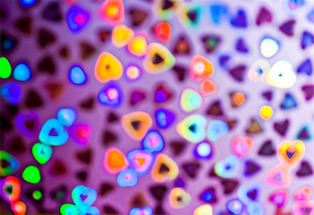 Blurry hearts of colorful decoration lights. Fotografie stock - Microstock e Abbonamento, Codice: 400-05323530
